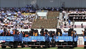 Trucks carrying criminals and suspects are seen during a mass sentencing rally at a stadium in Yili, Xinjiang Uighur Autonomous Region on May 27, 2014. Local officials in China's western Xinjiang region held the public rally for the mass sentencing of criminals on Tuesday, handing out judgments for 55 people and at least three death sentences for crimes such as "violent terrorism," state media said. [Reuters]