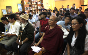The four Tibetan torture survivors (front row) watching the documentary with TCHRD Director,Tsering Tsomo (extreme right) and the audience.