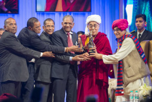 Guests including Govind Dholakia and the Governor of Gujarat, OP Kohli, presenting His Holiness the Dalai Lama with the Santokbaa Award in Surat, Gujarat, India on January 2, 2015. Photo/Tenzin Choejor/OHHDL