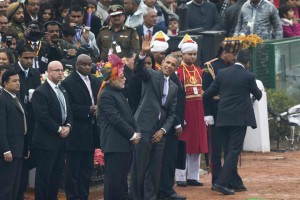 US President Barack Obama waves to the crowd flanked by Prime Minister Narendra Modi and first lady Michelle Obama at the end of the Republic Day parade in New Delhi. (AP)
