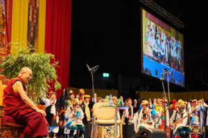 His Holiness the Dalai Lama listening to young singers and musicians performing an extract of Tibetan opera before his talk in Basel, Switzerland on February 8, 2015. Photo/Olivier Adam