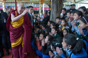 His Holiness the Dalai Lama waving to members of the crowd as he returns to his residence at the conclusion of his teaching on the final day of the Great Prayer Festival in Dharamsala, HP, India on March 5, 2015. Photo/Tenzin Choejor/OHHDL