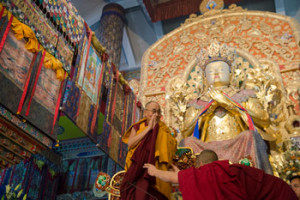 His Holiness the Dalai Lama taking his seat before a colossal statue of Maitrya Buddha at Palpung Sherabling Monastery in Upper Bhattu, HP, India on March 11, 2015. Photo/Tenzin Choejor/OHHDL