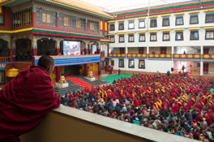 Monks, nuns and lay people watching His Holiness the Dalai Lama on a big screen in the courtyard of Palpung Sherabling Monastery in Upper Bhattu, HP, India on March 11, 2015. Photo/Tenzin Choejor/OHHDL