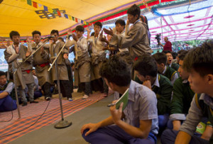 Students engaging in debates on Buddhist philosophy at the start of His Holiness's teaching at Tibetan Children's Village School (TCV) in Upper Dharamsala, HP, India on May 27, 2015. Photo/Tenzin Choejor/OHHDL