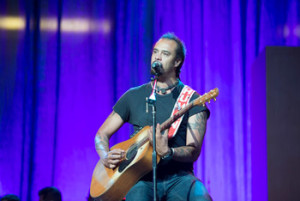Musician Michael Franti performing during celebrations honoring His Holiness's 80th birthday at the Honda Center in Anaheim, California, USA on July 5, 2015. Photo/Tenzin Choejor/OHHDL