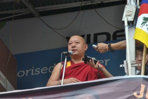 Geshe Nyima, Trulku Tenzin Delek Rinpoche's cousin addressing the crowd at Kacheri.