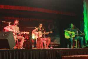 Local Tibetan rock band JJI Exile Brothers performing with a friend at the concert.