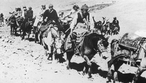 The 14th Dalai Lama fleeing from Tibet to India across the Himalayas, following a failed uprising against the Chinese occupation, in 1959. He is riding a white pony, third from the right. (Getty Images)