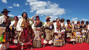 Tibetan performers wearing animal skin costumes.