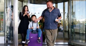 Chinese artist Ai Weiwei his wife Lu Qing and son Ai Lao at Munich airport: the activist has warned that his homeland must become a democratic society. Photograph: Matthias Schrader/AP