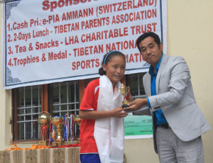 Best player (girls) receiving trophy and cash prize from Chief Guest Mr Sonam Dorjee.