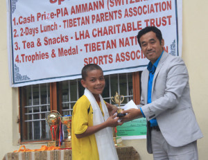 Best player (boys), Sonam Paljor receiving trophy and cash prize from Chief Guest Mr Sonam Dorjee. 