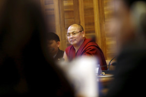 MARKED MAN: Tibetan monk Golog Jigme, who escaped from detention in China in 2012, addressing a side event during the June session this year of the United Nations Human Rights Council in Geneva. He and other activists say Chinese agents are hounding them at the U.N. body. REUTERS/Pierre Albouy