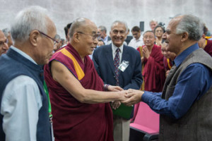 His Holiness the Dalai Lama greeting participants of the conference on Quantum Physics and Madhyamaka Philosophical View as he arrives at Jawaharla Nehru University's Convention Centre in Delhi, India on November 12, 2015. Photo/Tenzin Choejor/OHHDL