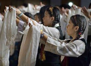  At the Minneapolis Convention Center, the Dalai Lama addressed a mostly Tibetan audience as part of a stay in Minnesota that includes visiting the Mayo Clinic for his health treatment. Children offered shawls in a dance to the spiritual leader.  Richard Tsong-Taatarii – Star Tribune