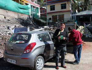 Speaker Penpa Tsering, one of the Sikyong candidates flashes his Green Book after arriving at the polling station at Gangchen Kyishong. (Image courtesy: Abhishek Madhukar) 
