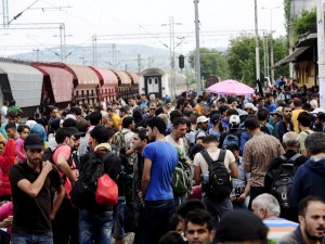 Migrants gather at Gevgelija train station in Macedonia after crossing Greece's border, Macedonia, August 22, 2015. (Photo: Reuters)