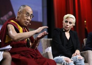 Lady Gaga listens as the Dalai Lama speaks during a question and answer session at the US Conference of Mayors in Indianapolis on Sunday. (AP)