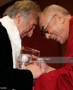 The Dalai Lama (R) presents the Light of Truth Award on behalf of the International Campaign for Tibet to Holocaust survivor and former Nobel Peace Prize recipient Elie Wiesel (L) during a ceremony November 15, 2005 in Washington, DC. Wiesel was presented with the award for his efforts on fighting for human rights and democratic freedoms for the Tibetan people. November 15, 2005| Credit: Alex Wong