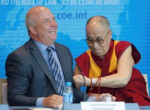 Tibet’s exiled spiritual leader the Dalai Lama (R) jokes with Nils Muiznieks, Commissioner for Human Rights of the Council of Europe, during his visit at the Council of Europe in Strasbourg, France, September 15, 2016. REUTERS/Vincent Kessler