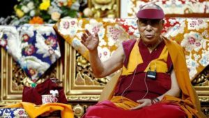 Tibet's exiled spiritual leader the Dalai Lama gestures during a teaching event in Milan. (Reuters) 