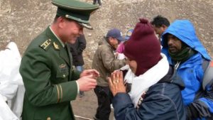 A Chinese army official greets the first batch of Kailash Mansarovar pilgrims from India at Taklakot also known as Burang City in China. (File photo)